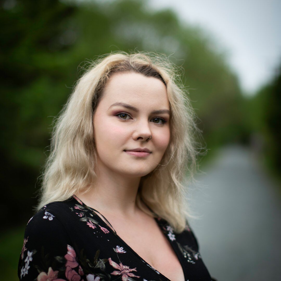 Professional headshot of female broadcast journalist and trainer