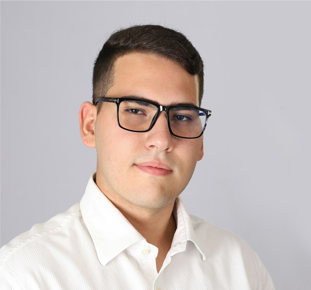 Professional headshot of male senior broadcast journalist