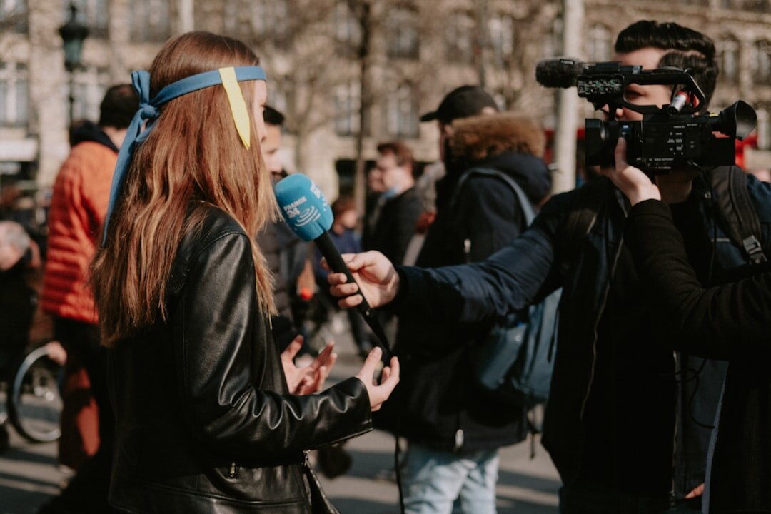 TV reporter doing live cross outdoors with microphone