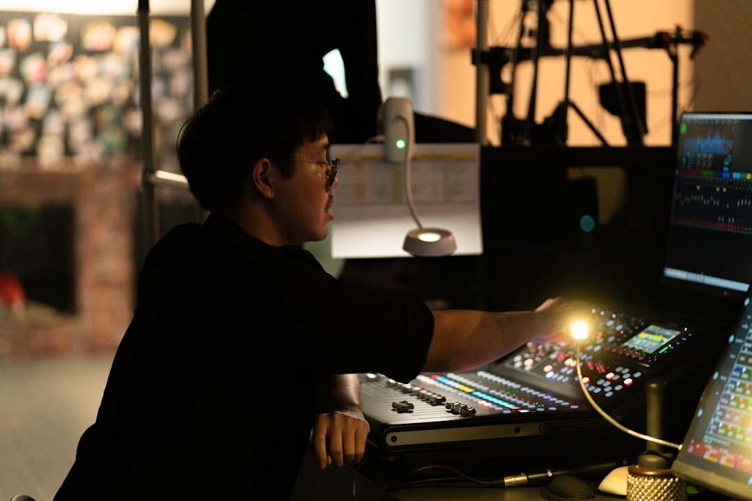 TV director watching monitors in broadcast control room